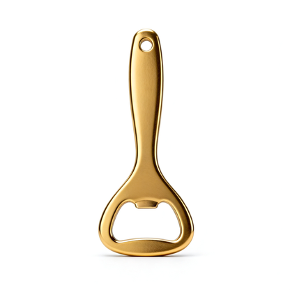 Gold-tone handheld bottle opener with elongated handle and integrated opener cutout on a white background