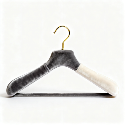 Dual-tone velvet clothes hanger with sculpted shoulders and curved hook on a white background