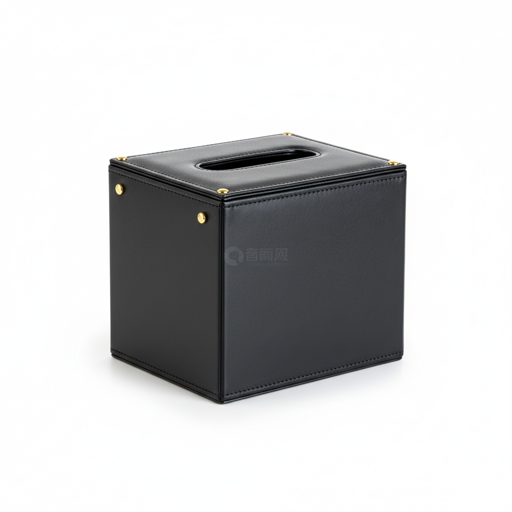 Black leather tissue box cover with gold rivets on white background